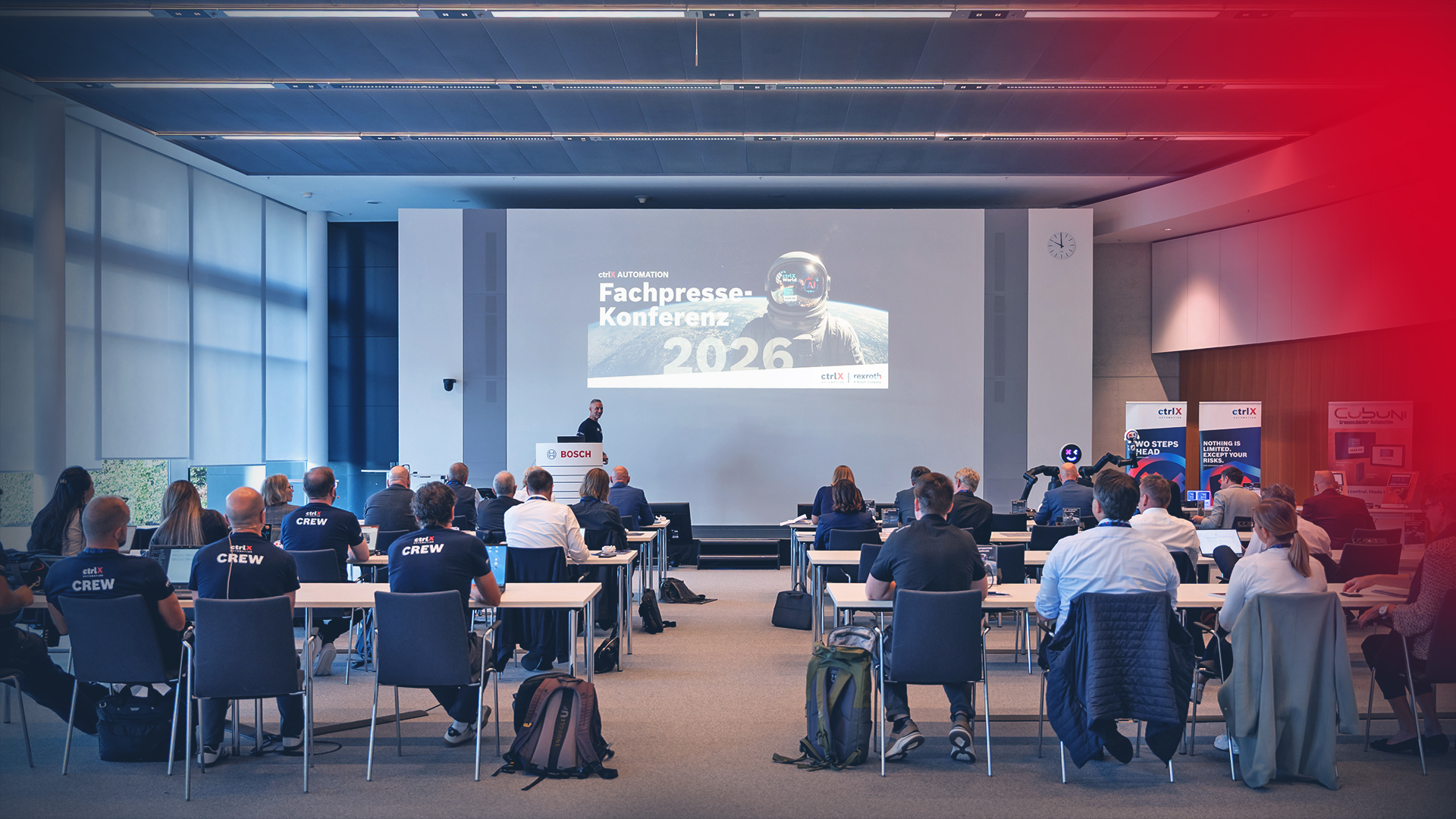 View of the conference room at the ctrlX AUTOMATION Trade Press Conference 2026 during a presentation to journalists and the audience.
