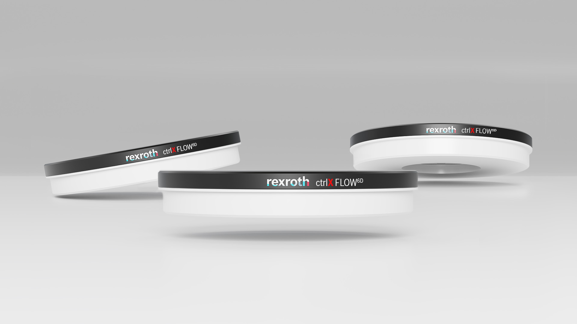 Three workpiece carriers of the contactless planar system ctrlX FLOW6D, which enables movements in 6 degrees of freedom such as simultaneous rotation, travel and tilt